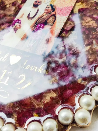 These images and videos showcase various angles and the creation process of my custom wedding and anniversary varmala preservation frames. Each one is made with love to turn your special memories into a timeless treasure.
