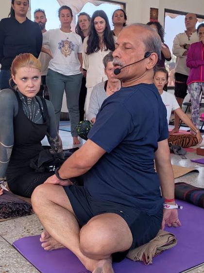 Teaching a seated twist to a class.