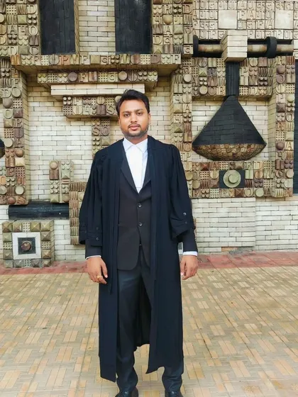 As an advocate, I am dedicated to my practice and present at the Delhi High Court. This image shows me in my professional advocate's gown, ready to represent my clients' interests with dedication.