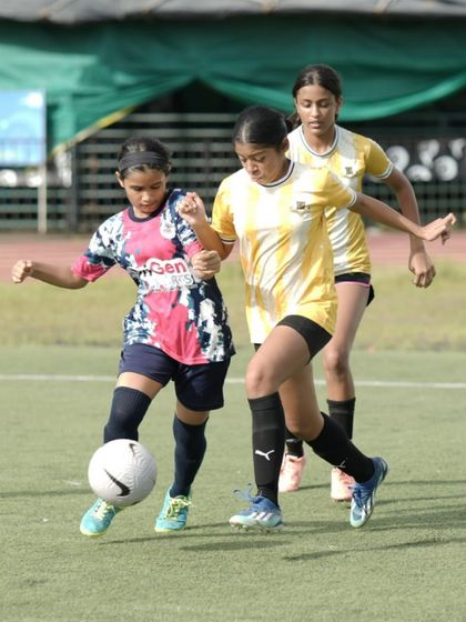 A player from our U16 girls' team skillfully shielding the ball during the SIS Powerplay 5v5 Women’s Tournament. This image captures the focus and determination we instill in our players.