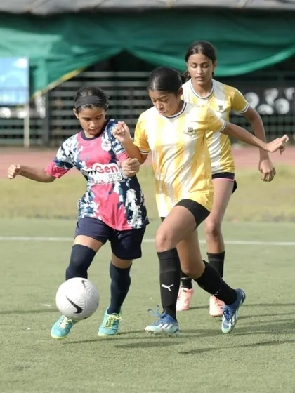 A player from our U16 girls' team skillfully shielding the ball during the SIS Powerplay 5v5 Women’s Tournament. This image captures the focus and determination we instill in our players.