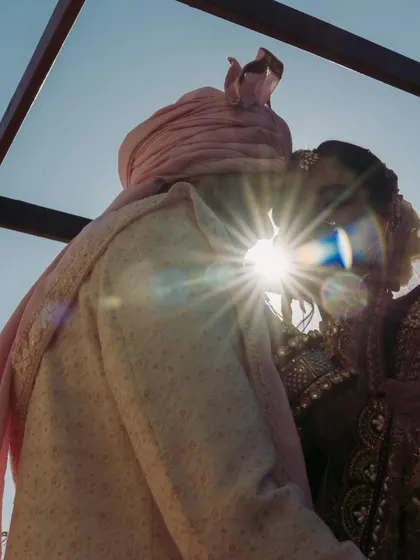 A perfect silhouette kiss against the sun. I work with photographers who have an eye for creative and artistic shots that turn your wedding photos into masterpieces.