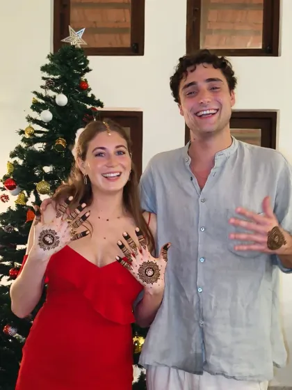 This couple's joy is infectious. They were so excited about their matching henna for the party.