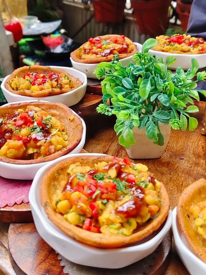 Our take on the classic Sindhi dish, Dal Pakwan. We serve the flavorful lentil curry in crispy, edible baskets, making it a perfect single-bite appetizer for any event.