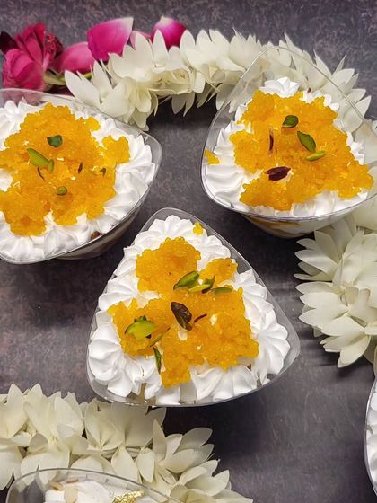 A top view of the Motichoor Tres Leches cups, garnished with pistachios. They are perfect for parties and festive get-togethers.