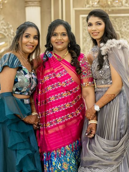A lovely family portrait where you can see the beautiful henna stains on everyone's hands.