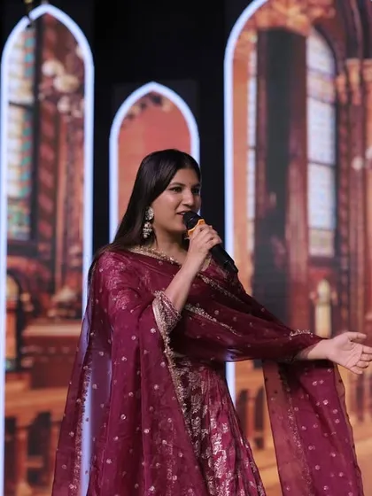 Explaining the next segment of the Sangeet. Clear communication and a friendly demeanor are essential for a smooth and enjoyable event.