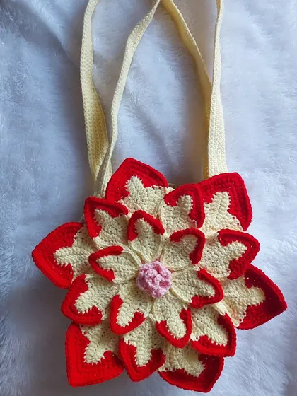 Another view of the Lotus Bag, focusing on the beautiful 3D construction of the flower petals.