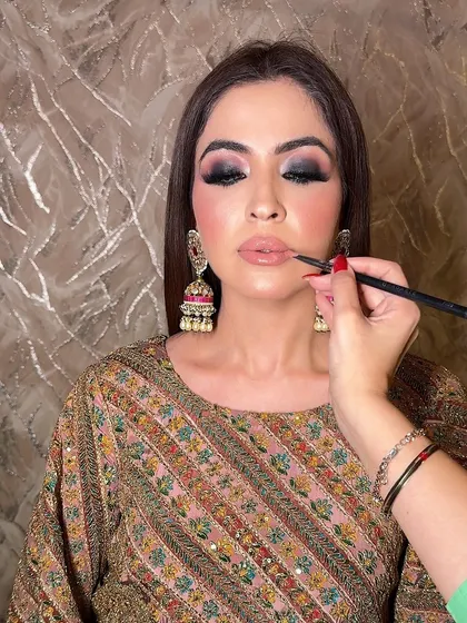 The key to a perfect smokey eye is blending. Here, I'm ensuring the edges are soft and diffused while maintaining the deep, rich pigment for a truly captivating look.