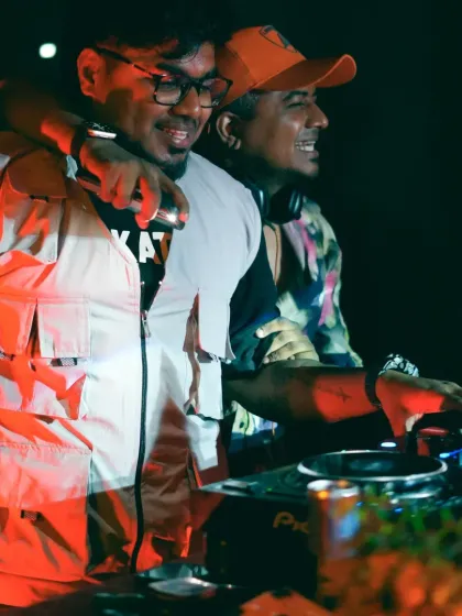 A candid moment with a fellow artist behind the decks. College fests are a great place to collaborate and share good vibes.