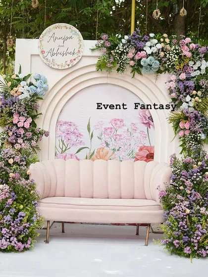For a modern and romantic engagement, I designed this beautiful pastel floral backdrop. The soft pink couch, surrounded by lush arrangements of roses and hydrangeas against custom arches, created the perfect dreamy atmosphere for Anupa and Abhishek.