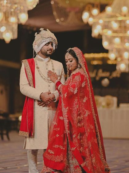 My gorgeous bride with her groom. The grandeur of the chandeliers adds to the royal feel of this picture.
