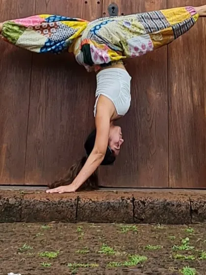 This is what dedication and consistent practice can lead to. Advanced poses like this split headstand aren't about perfection, but about exploring your potential. In my classes, we build up to these challenges together, step by step.