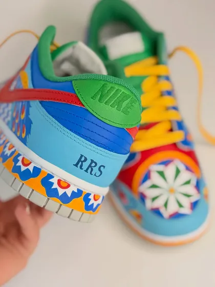 Personalization is key. For this pair, I added the client's initials "RRS" on the heel, making these custom Dunks truly his own.