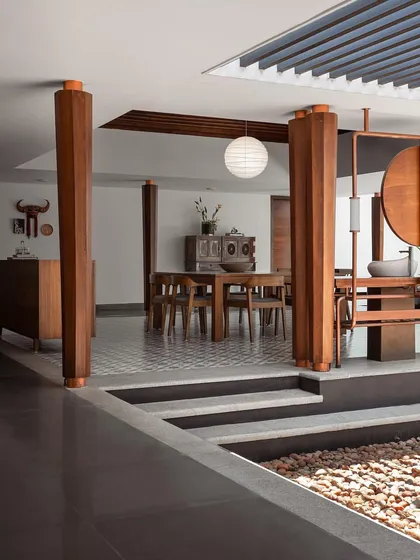 The 'House of Quad' in Kottayam blends vernacular Kerala architecture with contemporary design, featuring heavy wooden pillars and a sunken courtyard.