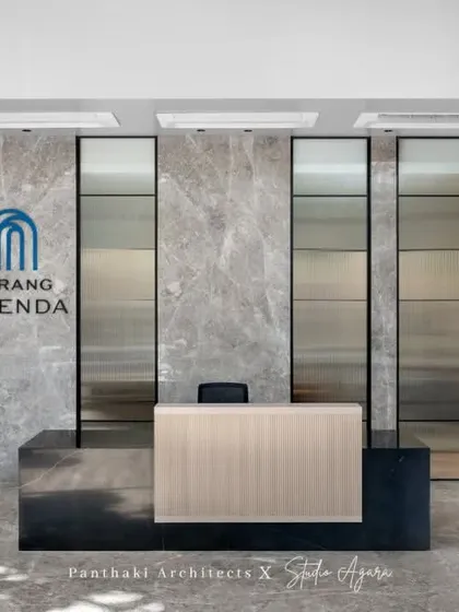 First impressions are crucial. For this Malad office, we designed a reception area that communicates professionalism and modern elegance. The combination of a marble feature wall, a minimalist desk, and warm, ambient lighting creates a welcoming and impressive entry point for clients and employees.