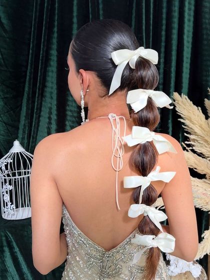 A detailed shot of the balloon braid, showcasing the placement of each bow to create a symmetrical and polished look.