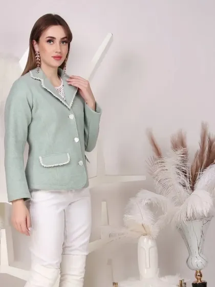 A chic mint green blazer styled for a semi-formal look. This type of photography is ideal for brands targeting working professionals or those seeking sophisticated casual wear.