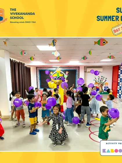 The joy is contagious! A room full of happy kids playing with balloons during our visit to a local summer camp.