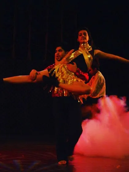 This is where hard work pays off. A shot from one of our stage shows, capturing a dramatic lift during a partner dance performance. My students learn the skills in class and then shine on stage.