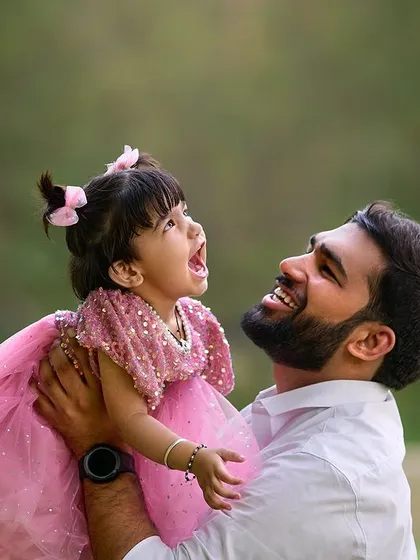 Capturing the sheer joy in a father and daughter's interaction. My goal is to photograph these energetic, happy moments that show the true spirit of your family, using natural light to highlight their expressions.