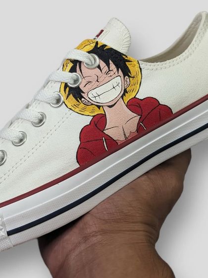 A clean and minimal custom featuring Monkey D. Luffy from One Piece on a pair of Converse Lows. Sometimes a simple portrait is all you need to show your love for a character.