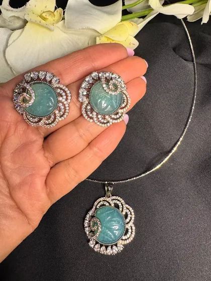 A closer look at the mint green version of my carved floral pendant set. The soft pastel color combined with the sparkle of the surrounding stones creates a fresh and elegant look.