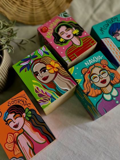 Another group of the personalized pen stands, showing the variety of hairstyles, expressions, and color palettes we used.