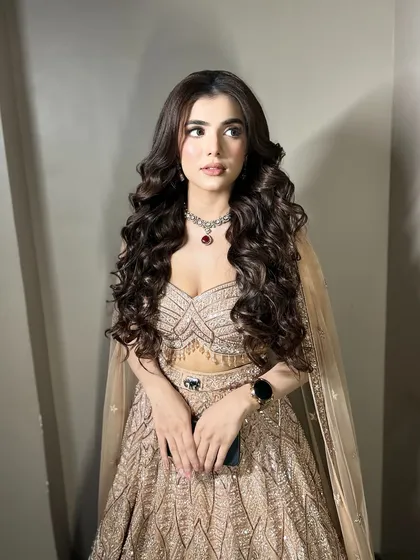 For this engagement, we went for full-on glamour with voluminous Hollywood waves and a soft, sculpted makeup look. This style is perfect for making a statement and is designed to look incredible in photos and last all night.