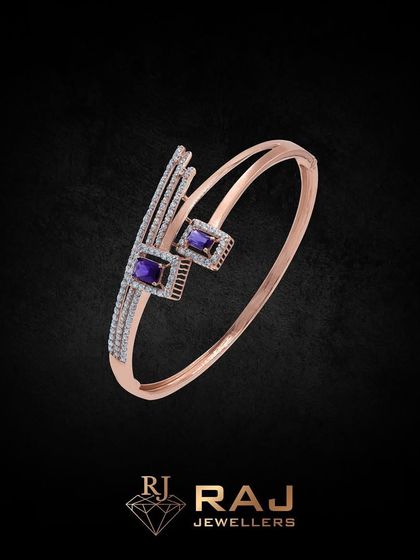 A sleek and modern open kada in rose gold, featuring clean lines and two square-cut purple stones. This piece is a perfect example of minimalist luxury.