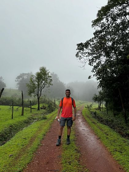 A solo trekker on a misty trail. These moments of quiet contemplation are a precious part of the trekking experience.