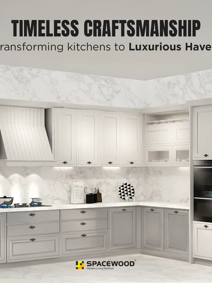 This design showcases timeless craftsmanship in a classic U-shaped layout. The combination of grey and white panelled cabinets, a marble-patterned backsplash, and integrated appliances creates a luxurious and functional haven for cooking.