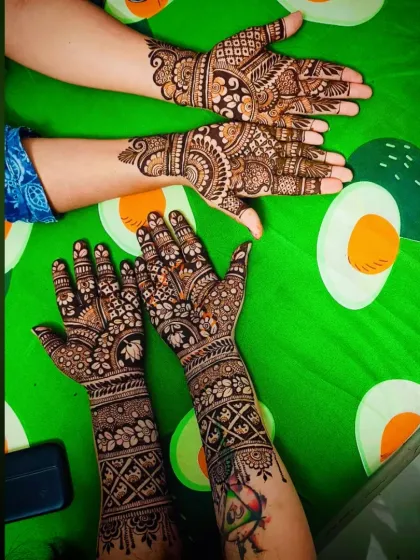 A fun group photo showing different mehandi designs on multiple people, perfect for a henna party.