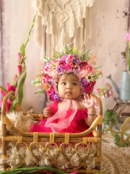 A full view of the bohemian floral setup for a half-birthday session, showcasing the beautiful textures and props used.