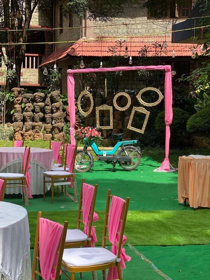 A fun and stylish photo corner for a wedding reception at UTC. The pink drapes and vintage props provide a perfect backdrop for guests to take memorable photos.
