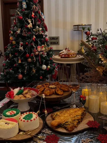 My Christmas dessert spread is a feast for the eyes. It includes mini cakes, strawberry croissants, and savoury Christmas tree bread.