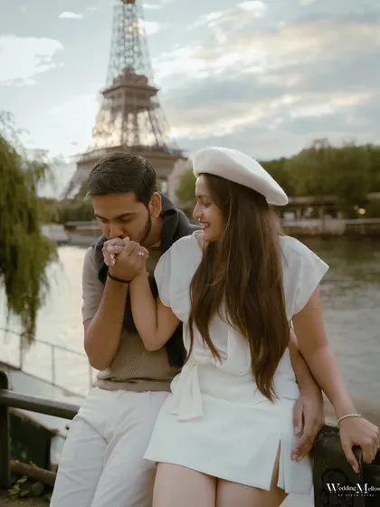 A tender moment by the River Seine in Paris. The gentle kiss on the hand and the iconic backdrop make this a perfectly romantic and classic pre-wedding photograph.