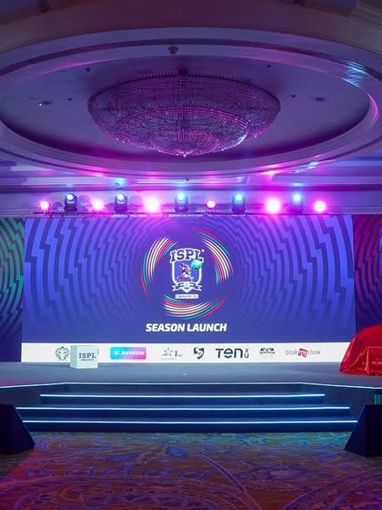 The stage for the ISPL Season 3 launch, with a car under wraps, ready for the big reveal. This behind-the-scenes shot shows the setup before the press conference began.
