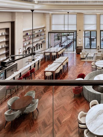 An overhead perspective of the bar and dining area at Elevate, revealing the carefully planned circulation and herringbone wood floors that guide movement and define different functional zones.