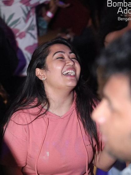 Pure joy and laughter from someone in the crowd at Bombay Adda during a 'Wicked Wednesday' night.