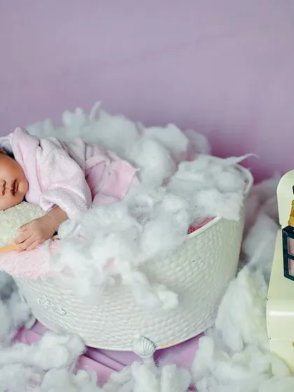 A full view of the newborn spa theme, complete with a makeup palette prop for a touch of glamour.