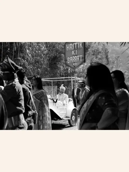 A classic black and white shot of the groom's Baraat, capturing a timeless view of the procession.