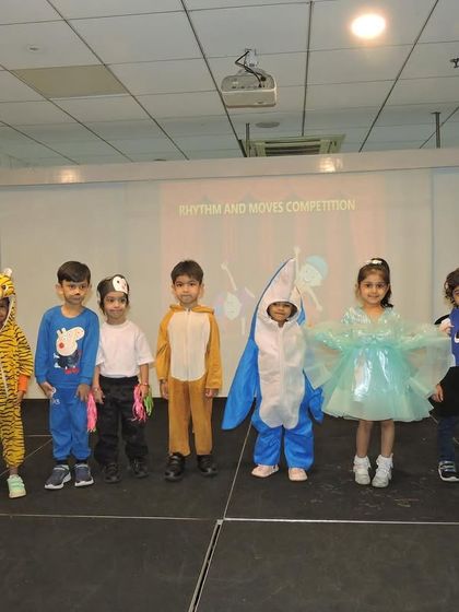 Our "Rhythm and Moves" competition brings out the creativity and enthusiasm of our students. This group of performers, in their wonderful costumes, is ready to light up the stage.
