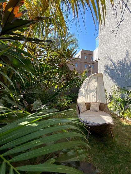 Nestled among dense foliage, this outdoor daybed offers a complete retreat from the world. I design these small, hidden spaces to encourage quiet moments and a deep connection with nature.