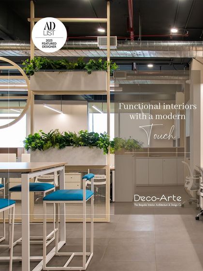 Functional interiors with a modern touch. This office space is as practical as it is stunning, using biophilic design with integrated planters and clean lines to create a productive environment.