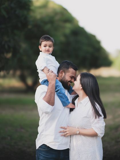 A family enjoying a walk in the park together.