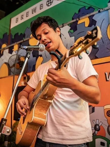 A close up shot from a jam session at Brewbot. I love playing my acoustic guitar and singing for an energetic crowd.