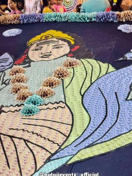 The floor covering for the pandal was also a large piece of art made from currency material, depicting a deity. I ensure that the decoration is immersive, covering every surface to create a complete experience for devotees.