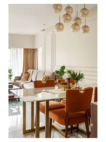 The dining room of 'Calm Abode' was a key part of our portfolio submission. The warm tones and elegant lighting fixture demonstrate our approach to creating inviting spaces for families to gather.