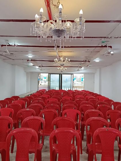 Our Kalyan East hall is perfect for smaller functions. This image shows the seating capacity and the elegant chandeliers that add a touch of class to the space.